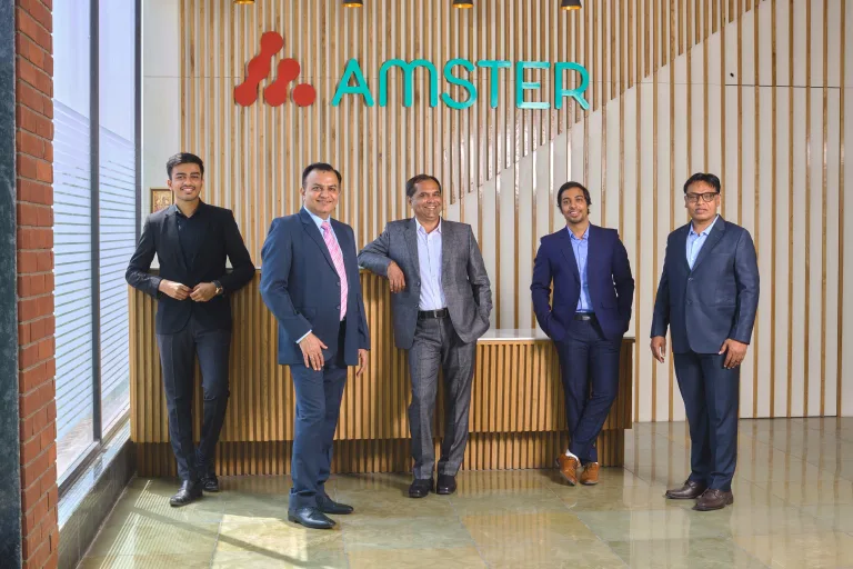 The Amster Microcell management team standing together in reception
